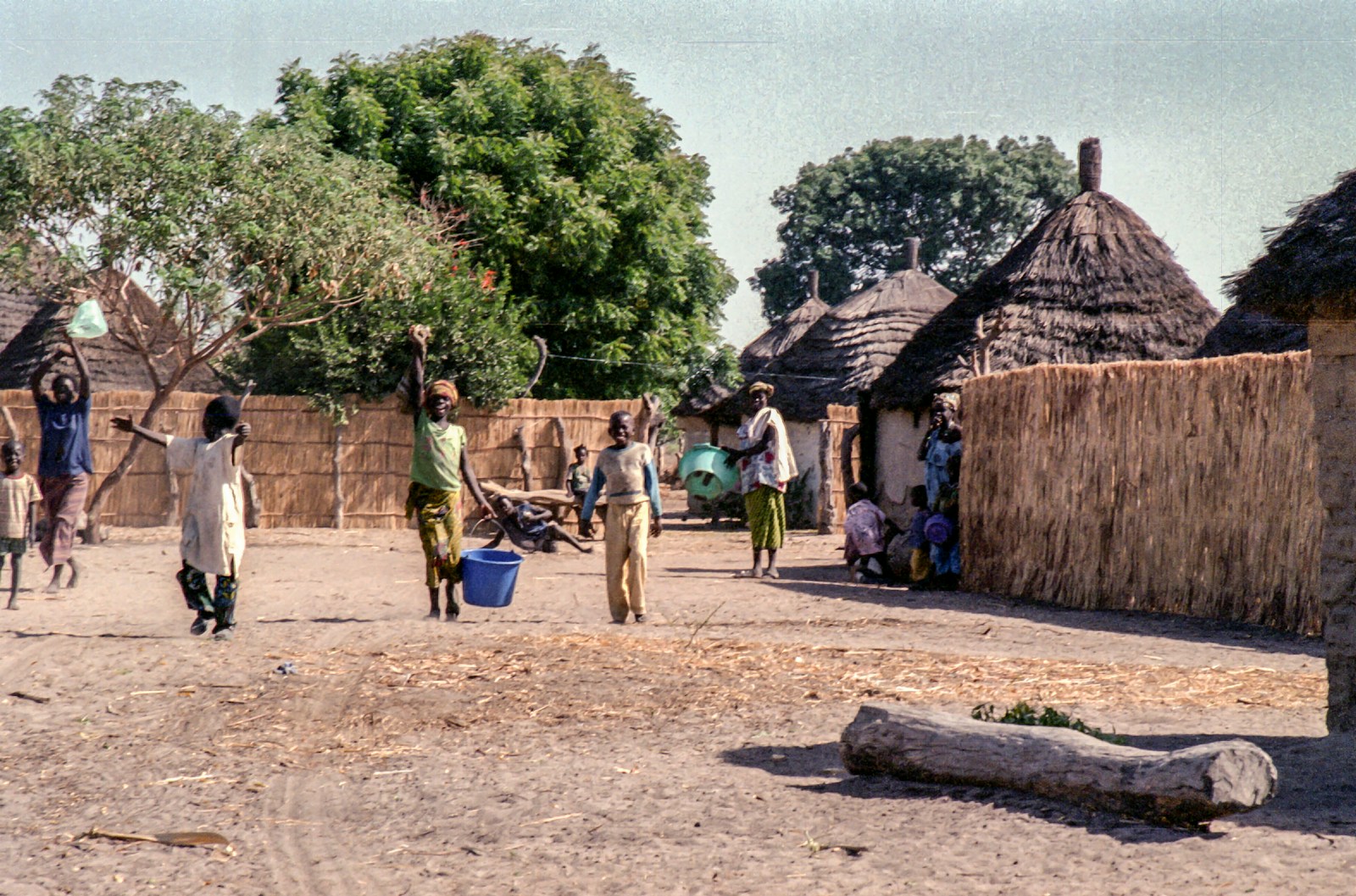 People are working in a small african village.